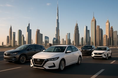 Modern vehicles on Dubai roads with city skyline